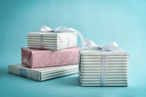 Several gift striped boxes with grey ribbon Stock Photos