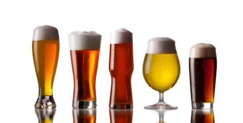 Several glasses of beer with cap of foam Stock Photos