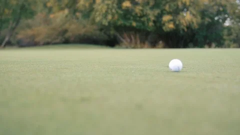 Several golf balls hit to hole close up on green Video stock 102673976
