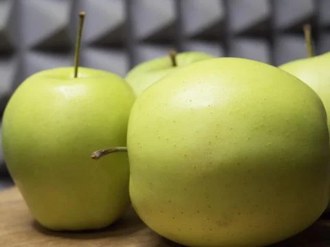 Several green apples, side view. Fruit close-up. Stock Photos