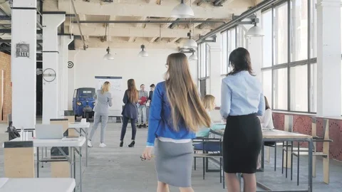 Several groups of employees are preparing for a meeting, approach the table and Stock Footage 109504801