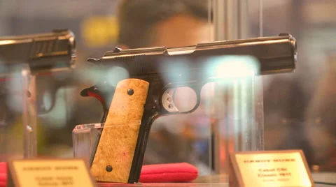Several Guns Standing on the Weapons Exhibition Stock Footage 68601379