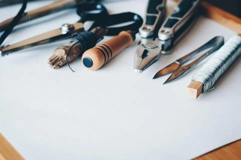 Several Handheld Tools on White Printer Paper Stock Photos