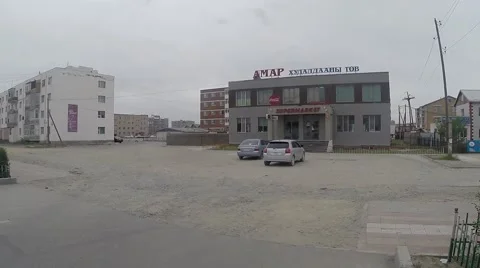 Several High-Rise Buildings About Which Parked Car in Mongolian City Stock Footage 62578993