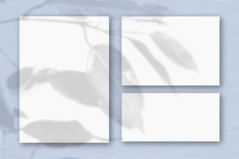 Several horizontal and vertical sheets of white textured paper on the backgro Stock-Illustration