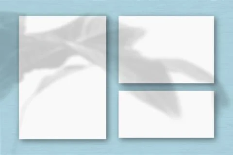 Several horizontal and vertical sheets of white textured paper on the backgro Stock Illustration