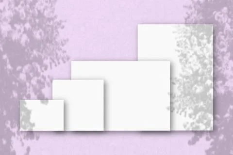 Several horizontal and vertical sheets of white textured paper against a pink Stock Illustration