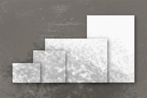 Several horizontal and vertical sheets of white textured paper against a gray Stock Illustration