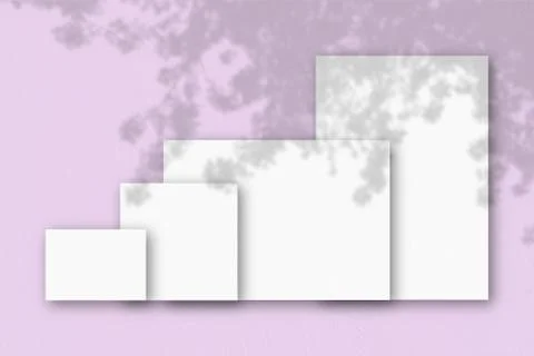 Several horizontal and vertical sheets of white textured paper against a pink Stock Illustration