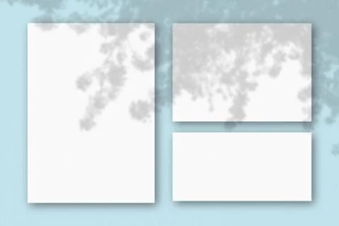 Several horizontal and vertical sheets of white textured paper on the backgro Illustrazione stock