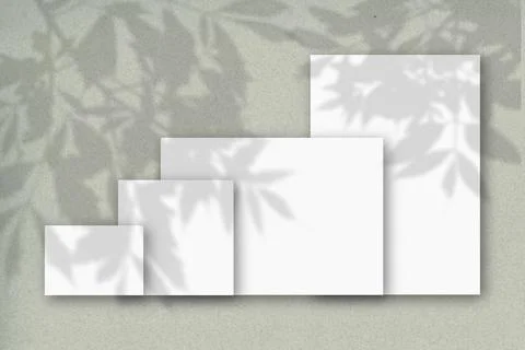 Several horizontal and vertical sheets of white textured paper against a gray Stock Illustration