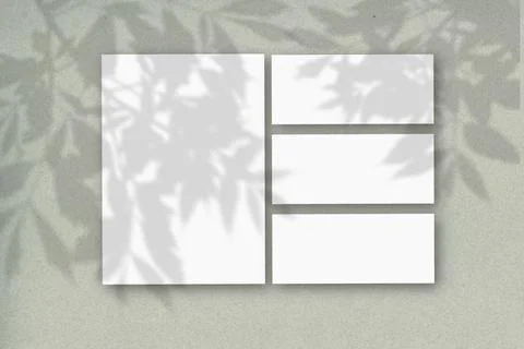 Several horizontal and vertical sheets of white textured paper against a gray Stock Illustration