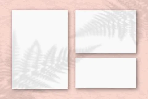 Several horizontal and vertical sheets of white textured paper against a pink Stock Illustration