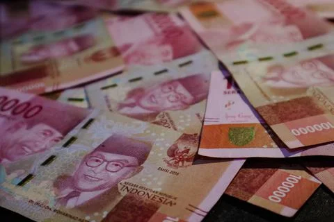 Several hundred thousand rupiah coins were scattered. Stock Photos