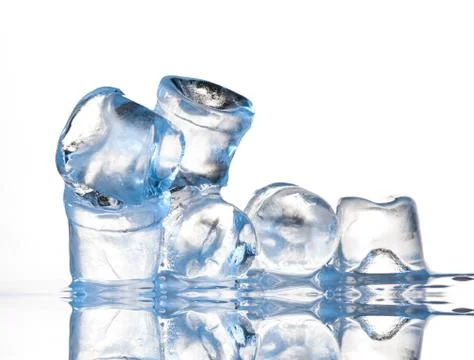 Several ice cubes on glass table Stock Photos
