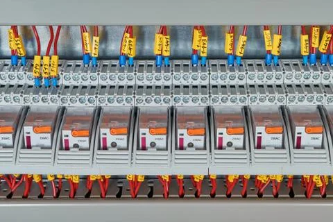 Several intermediate relay blue wires are connected according to the scheme. Stock Photos