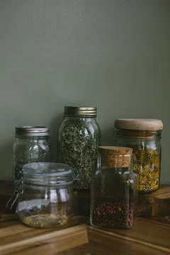 Several jars of dried herbs Stock Photos