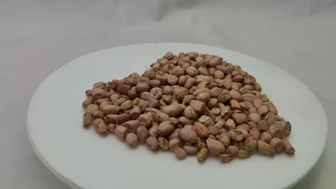 Several kernels with peanut shell forming a heart Stock Footage 271143100