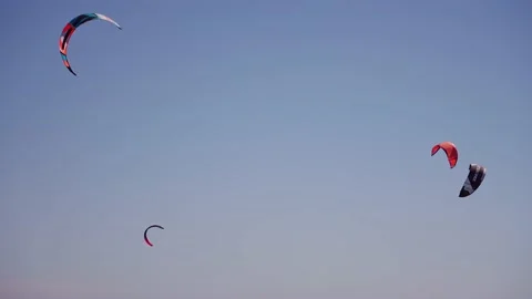 Several kitesurfing sails of on the sky Stock Footage 205356580