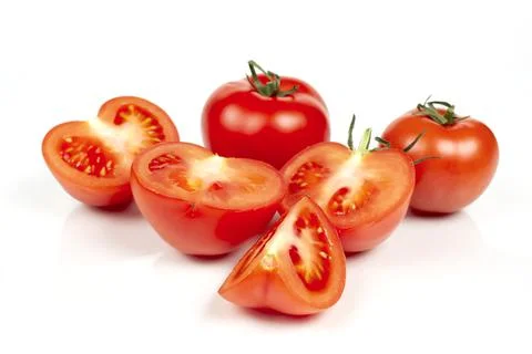 Several large red tomatoes close-up on a white background Stock Photos