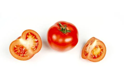 Several large red tomatoes close-up on a white background Foto stock
