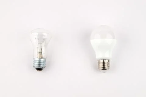 Several LED energy saving light bulbs over the old incandescent, use of Stock Photos
