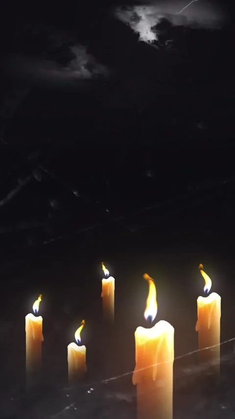 Several lit candles casting a warm glow in a dark, atmospheric setting Vidéo 317493547