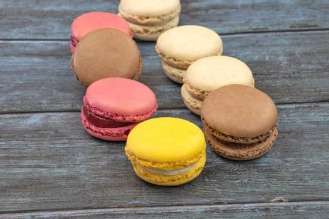 Several macarons on a gray background Stock Photos