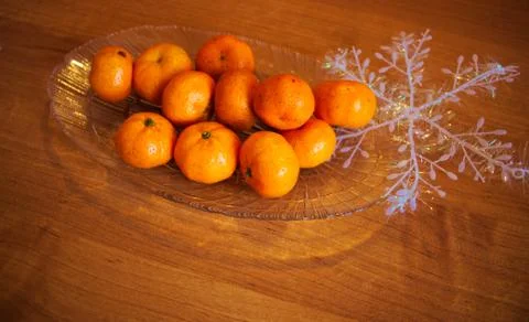 Several mandarins on a platter on a table Stock Photos