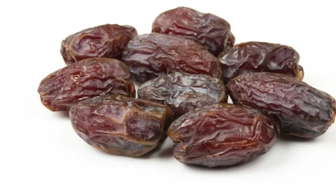 Several medjoul dates, close-up, isolated on a white background Stock Footage 280896201