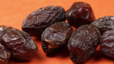 Several medjoul dates, close-up, isolated on a table Stock Footage 280896205