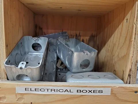Several Metal Electrical Boxes for Outlet or Switch in Wood Storage Box Stock Photos