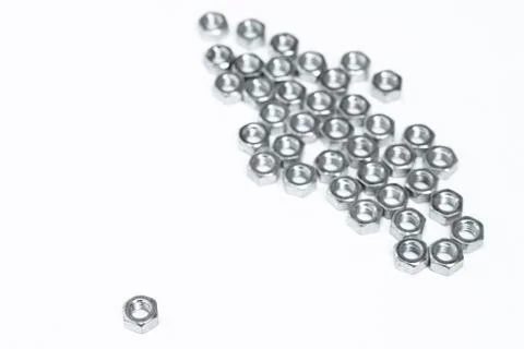 Several metal nuts on a white background Stock Photos