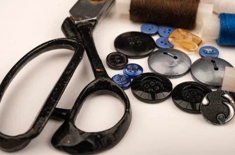 Several multi-colored buttons of different sizes and large vintage sartorial  Stock Photos