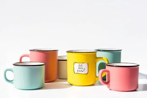 Several multi-colored coffee cups and one with the inscription Did you know Stock-Fotos