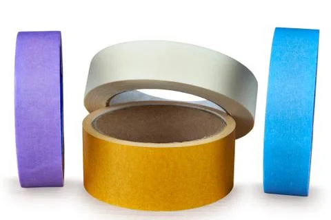 Several multi-colored rolls of adhesive tape on an white background. Stock Photos