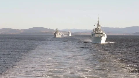 Several navy ships navigating in the open ocean Stock Footage 114018536