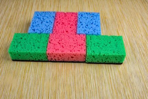 Several new multi-colored kitchen washcloths. Stock Photos