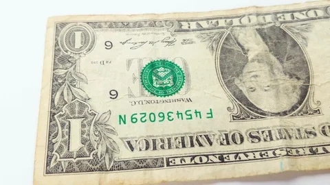 Several One Dollar banknotes thrown to the white background. Stock Footage 122940769