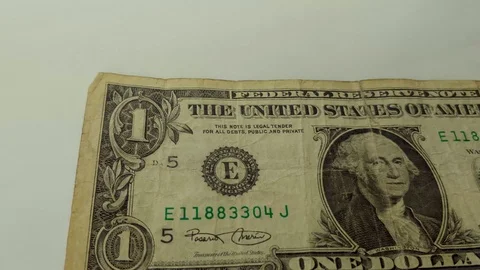 Several One Dollar banknotes thrown to the white background. Stock Footage 123235072