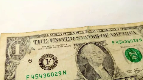 Several One Dollar banknotes thrown to the white background. Stock Footage 123235085