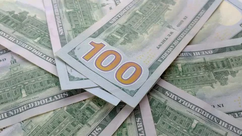 Several One hundred Dollar banknotes rotating in the frame. Stock Footage 123235095