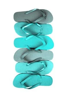 Several pairs of multi-colored rubber flip-flops exhibited in a row, isolated Stock Photos