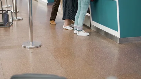 Several passengers standing in queue while waiting for check-in registration Stock Footage 112690361