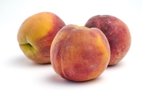 Several peaches isolated on white background. Stock Photos