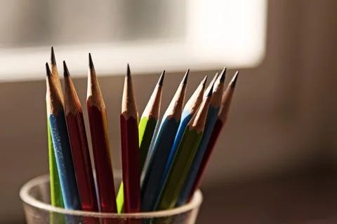 Several pencils in backlight by window Stock Photos