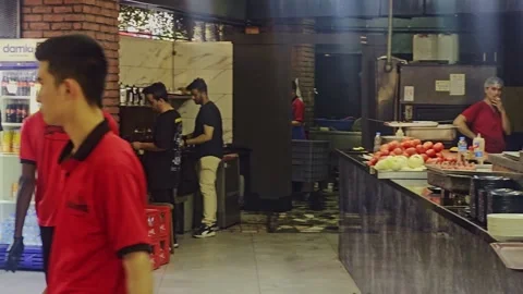 Several people are in a kitchen preparing. Video stock 284668902