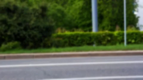 Several people engaged in cycling and rollerblading activities along a 動画素材 344094209