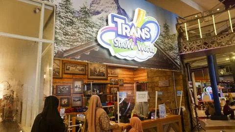 Several people queue in front of the entrance to Trans Snow World Stock Photos