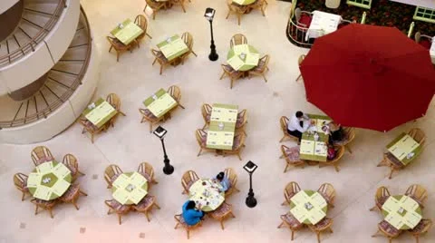 Several people sit at tables on cafe Stock Footage 10856301